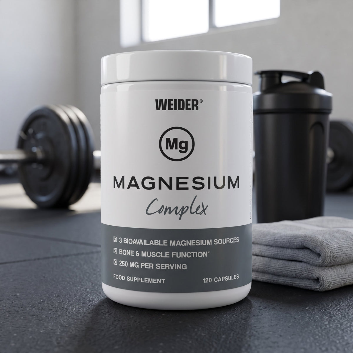 Weider Magnesium Capsules, on a gym floor beside a shaker