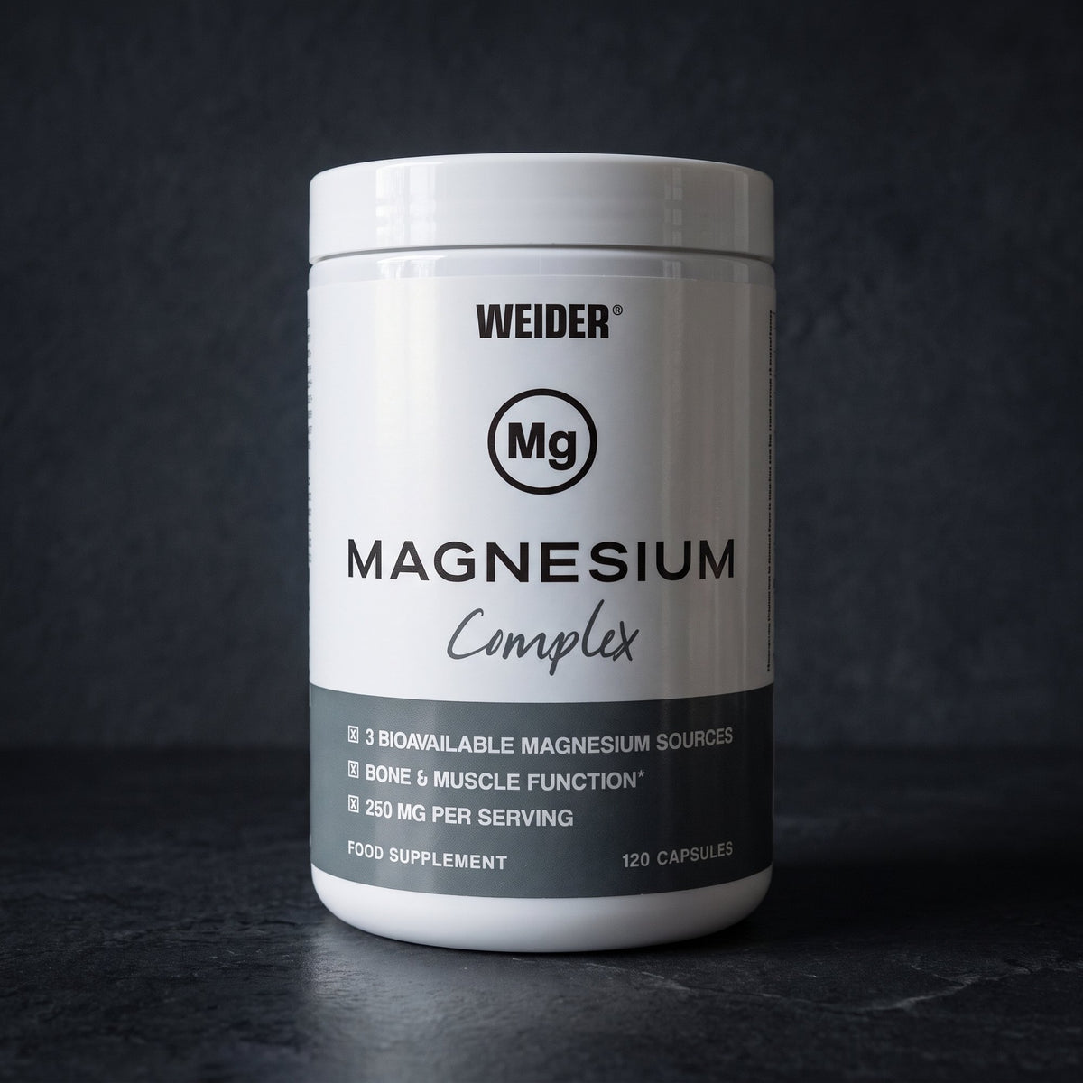 Weider Magnesium Capsules, on dark stone