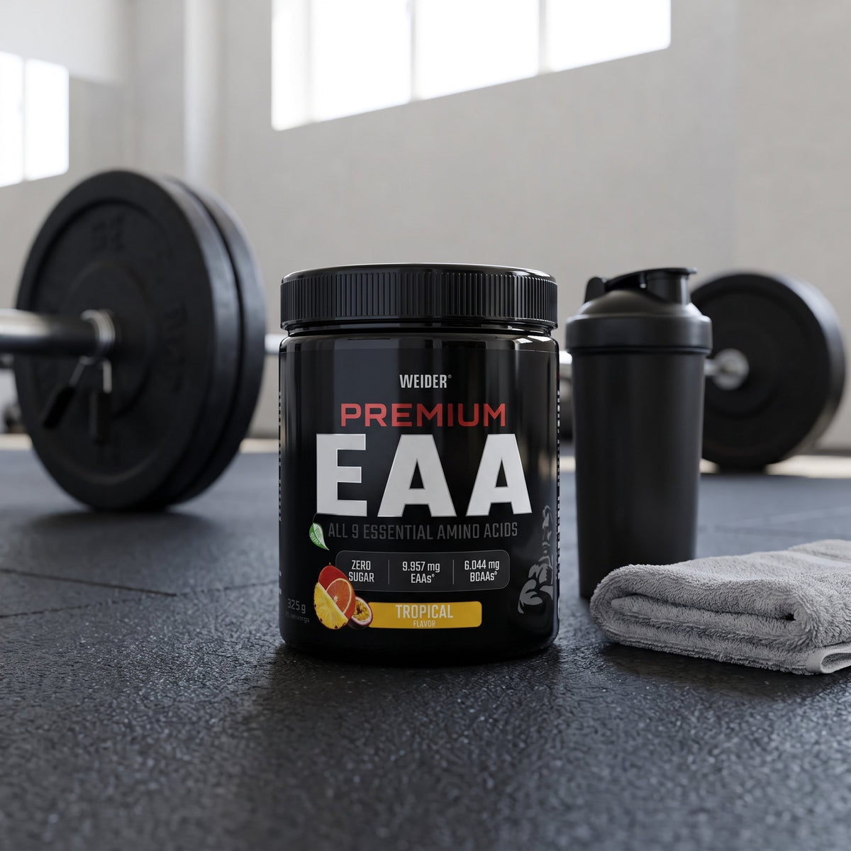 Weider Essential Amino Acids, on a gym floor beside a shaker