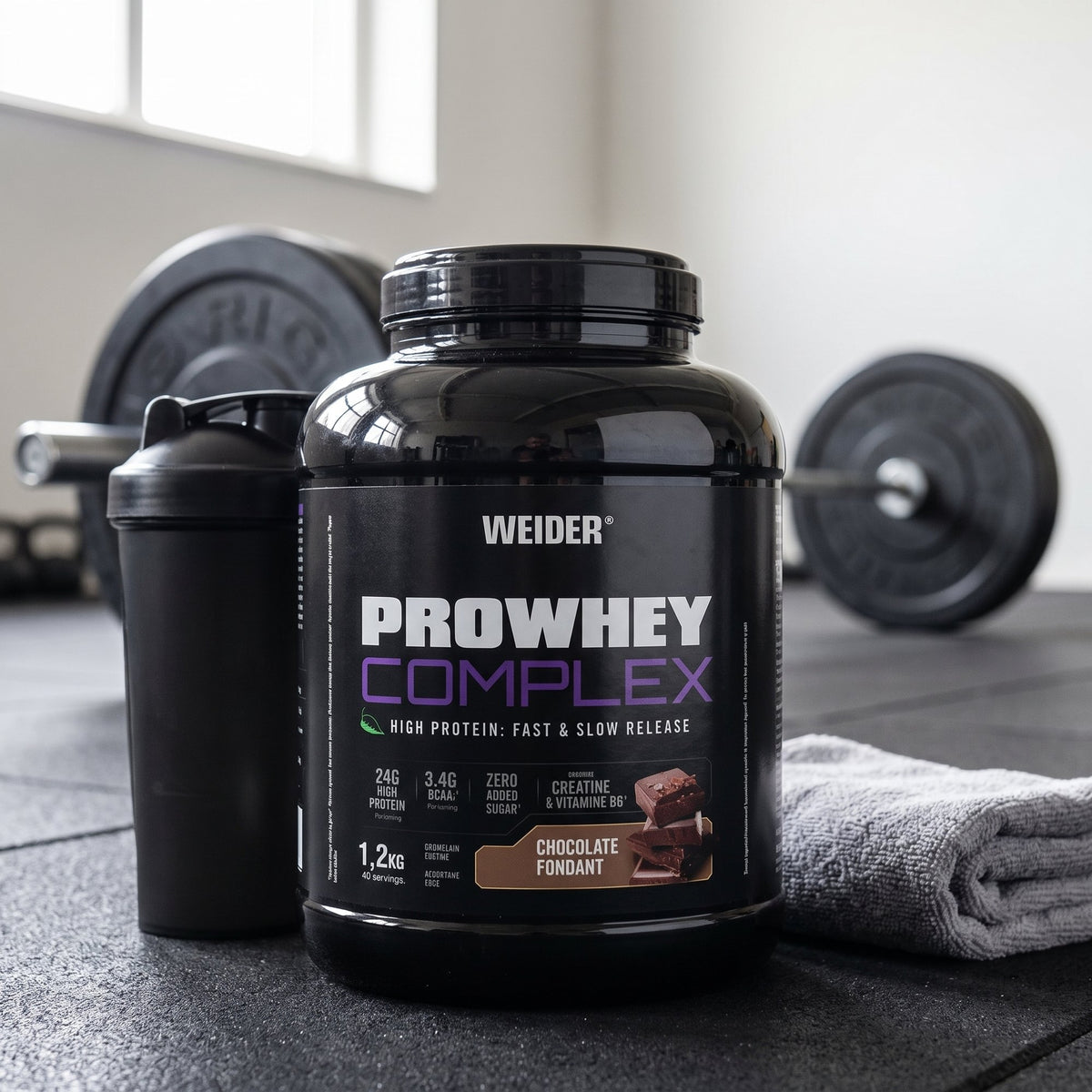 Weider Whey Protein, Everyday, on a gym floor beside a shaker
