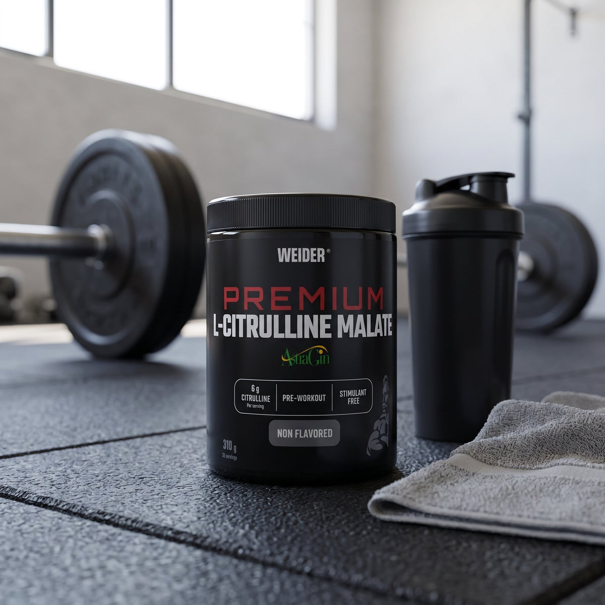 Weider Citrulline Malate, on a gym floor beside a shaker