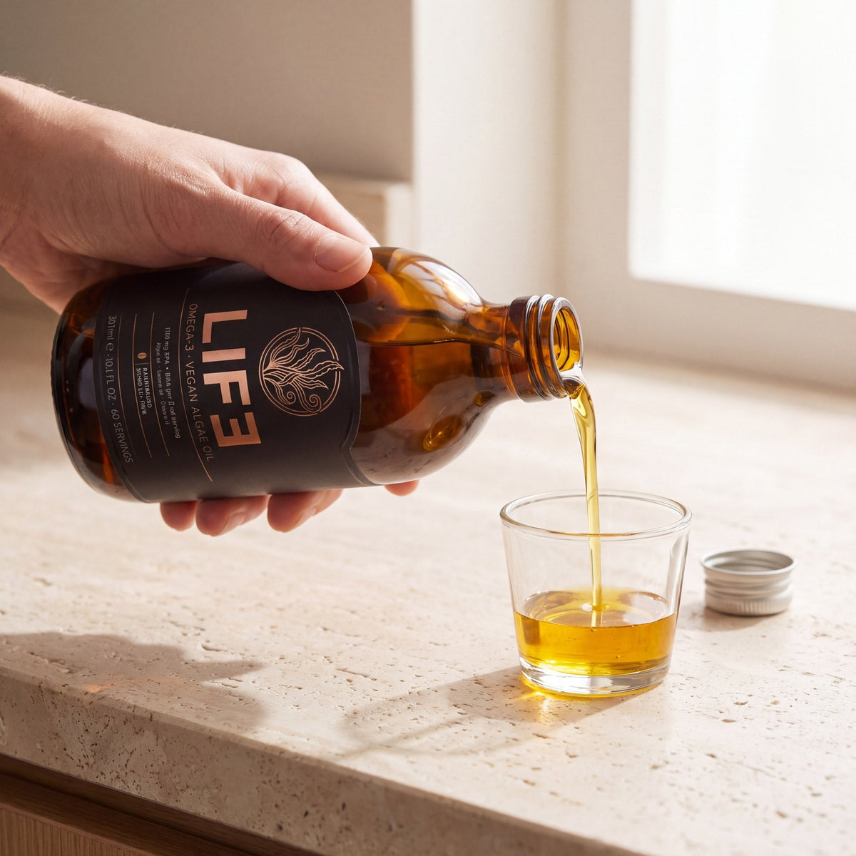 LIF3 Omega-3 vegan algae oil, 300 ml, poured into a glass dosing cup
