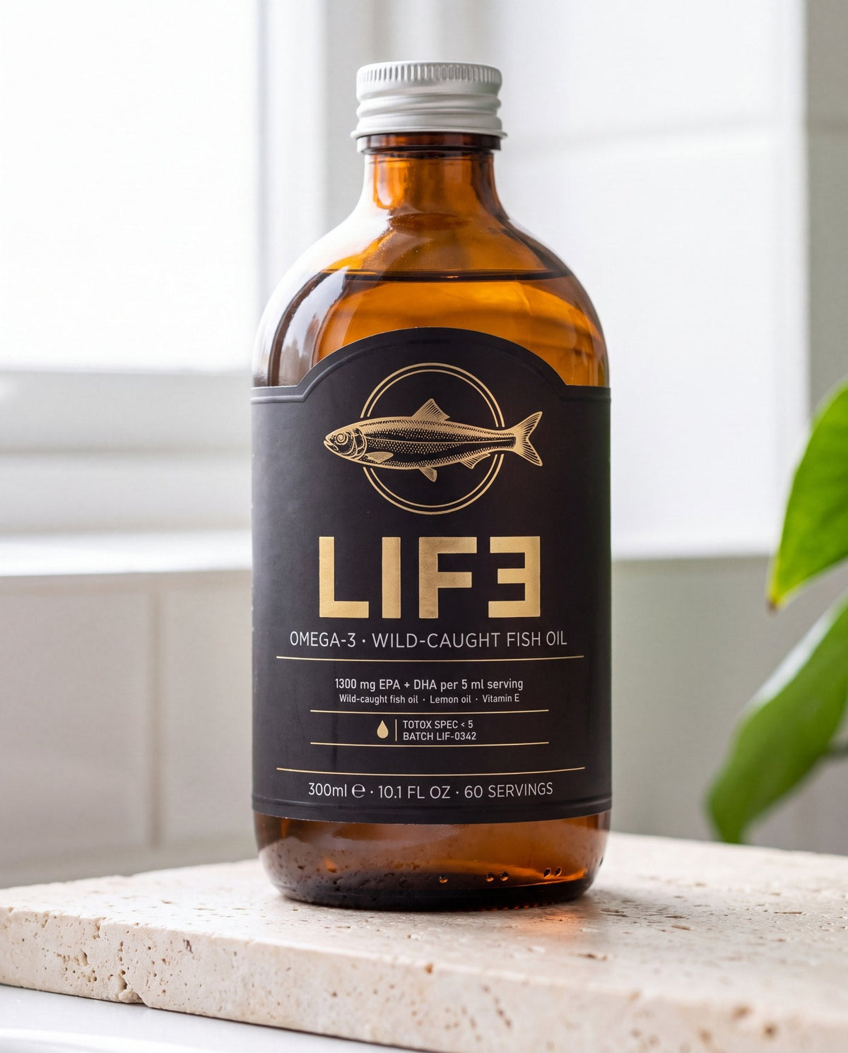 LIF3 Omega-3 wild-caught fish oil, 300 ml, on a travertine shelf by a window