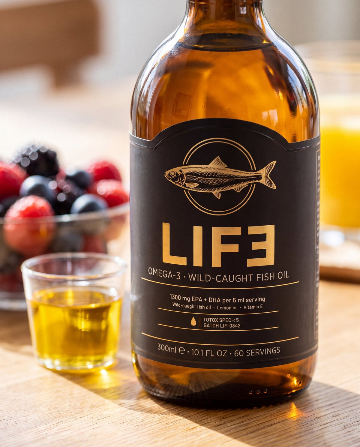 LIF3 Omega-3 wild-caught fish oil, 300 ml, on a breakfast table beside a glass dosing cup of oil