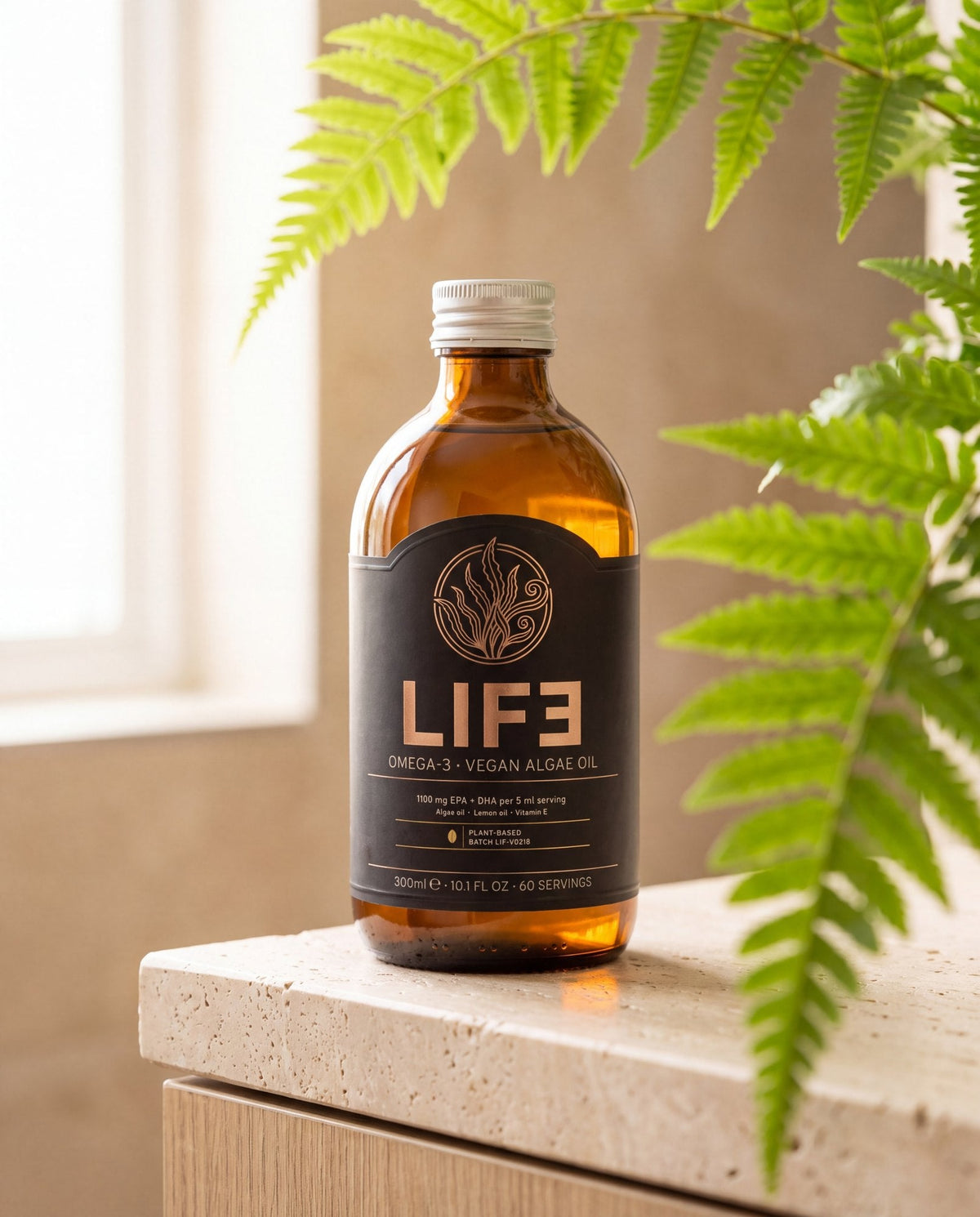 LIF3 Omega-3 vegan algae oil, 300 ml, on a travertine shelf by a window