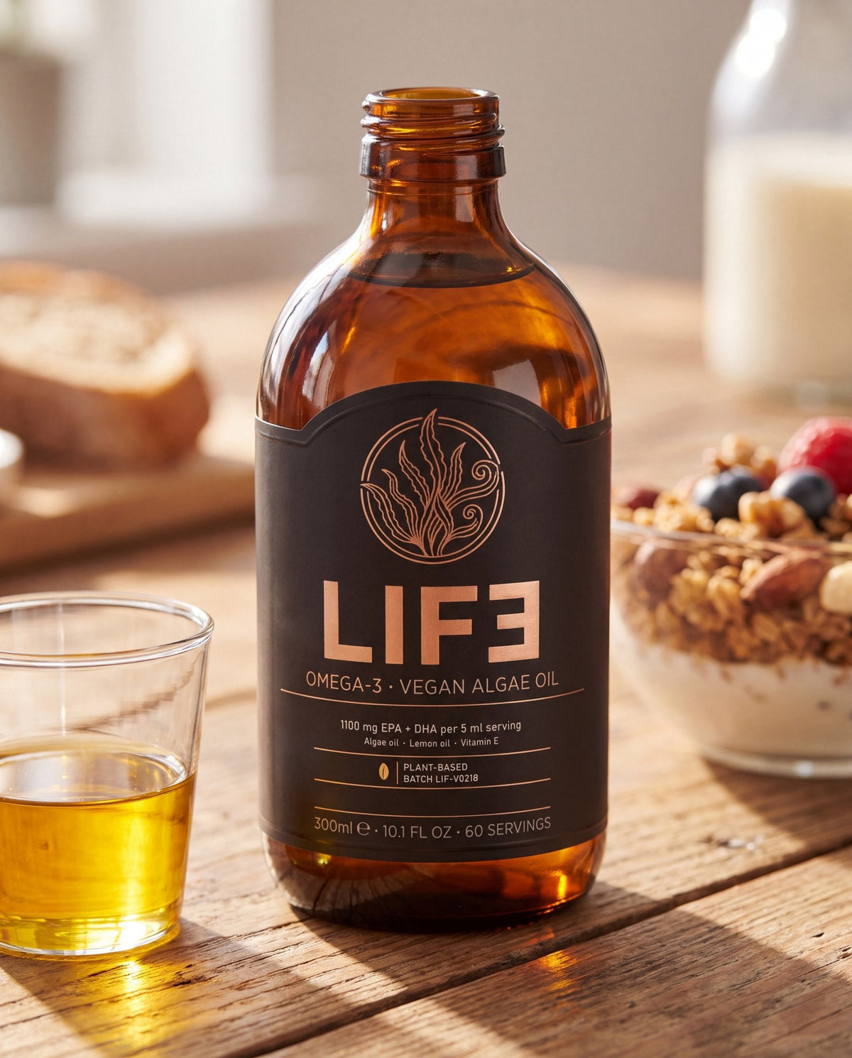 LIF3 Omega-3 vegan algae oil, 300 ml, on a breakfast table beside a glass dosing cup of oil