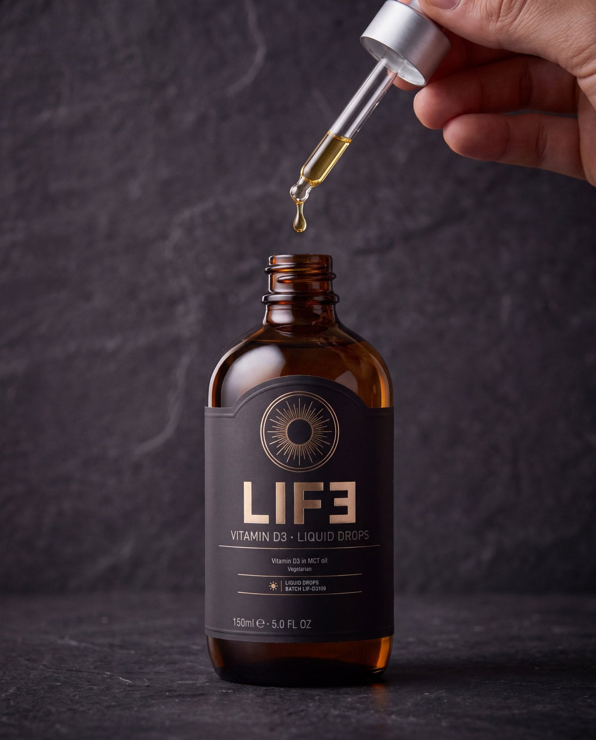 LIF3 Vitamin D3 liquid drops, 150 ml, on dark stone